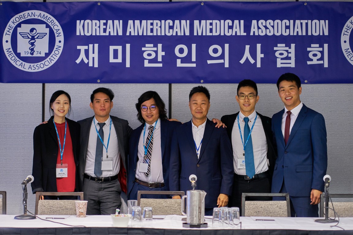 KAMA panel group photo with banner