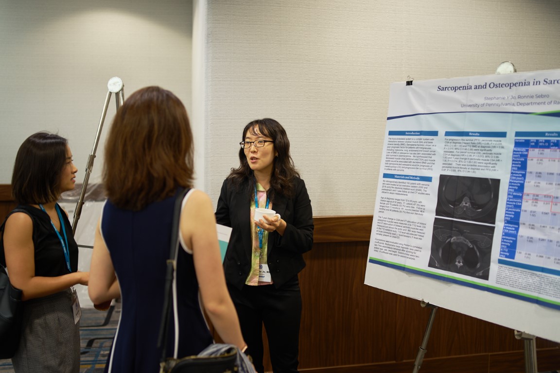 Researcher presenting poster on sarcopenia