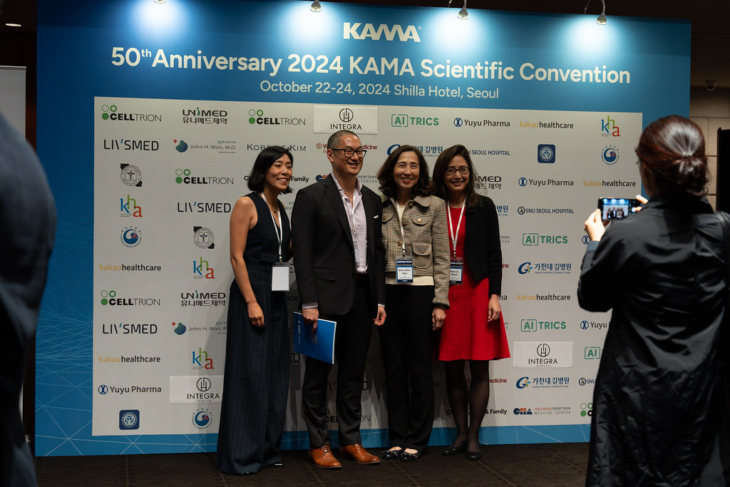 Members at Seoul convention photo backdrop